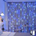 JMEXSUSS 300LED Christmas Curtain Lights Plug in with Remote, Blue and White Christmas Lights Indoor Outdoor, 8 Modes Hanging Fairy String Lights for Bedroom Window Wall Yard Patio Decor, 9.8x9.8ft-Ruum Studio Home