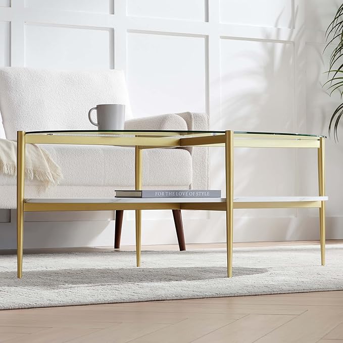 Oval Glass Coffee Table, Mid-Century Modern Design, L43 x W22 x H17 inch, Surfboard Shaped Clear Glass Top and White Marble Finish Wood Shelf, Tapered Legs with Gold Finish Frame-Ruum Studio Home