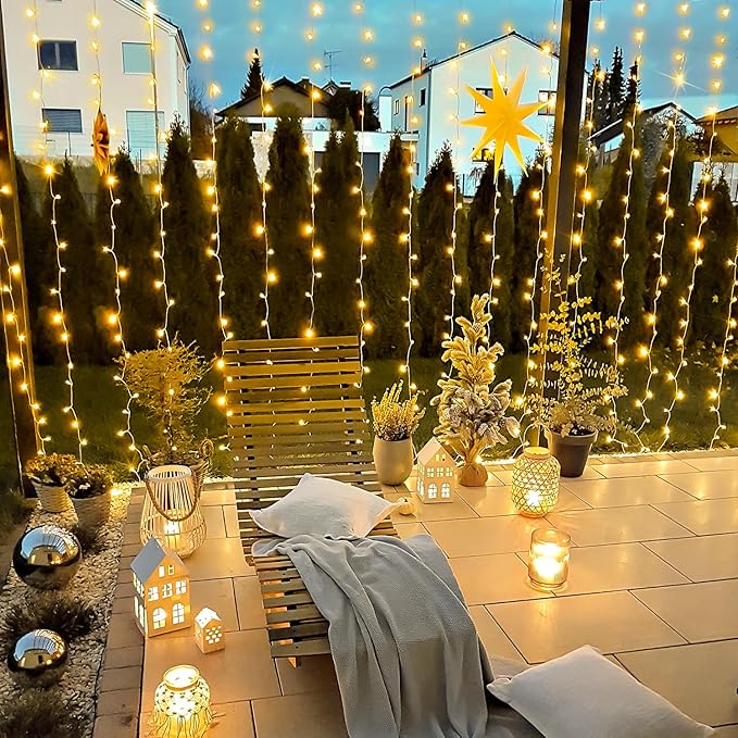 JMEXSUSS 900 LED Outdoor Christmas Curtain Lights, 9.5x29.5ft Christmas Lights Plug in with Remote, Twinkle Hanging String Light for Bedroom Wall Wedding Backdrop Window Gazebo Decor, Warm White-Ruum Studio Home