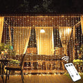 JMEXSUSS 600 LED Christmas Curtain Lights Outdoor, 9.5x19.6ft Christmas String Light Plug in with Remote, 8 Modes Wall Hanging Lights for Bedroom Party Backdrop Wedding Xmas Decor, Warm White-Ruum Studio Home