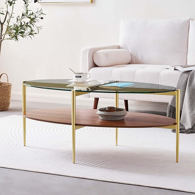 Oval Glass Coffee Table, Mid-Century Modern Design, L43 x W22 x H17 inch, 2-Tier Structure, Olive Shaped Clear Glass Top and Walnut Finish Wood Shelf, Tapered Legs with Gold Finish Frame-Ruum Studio Home