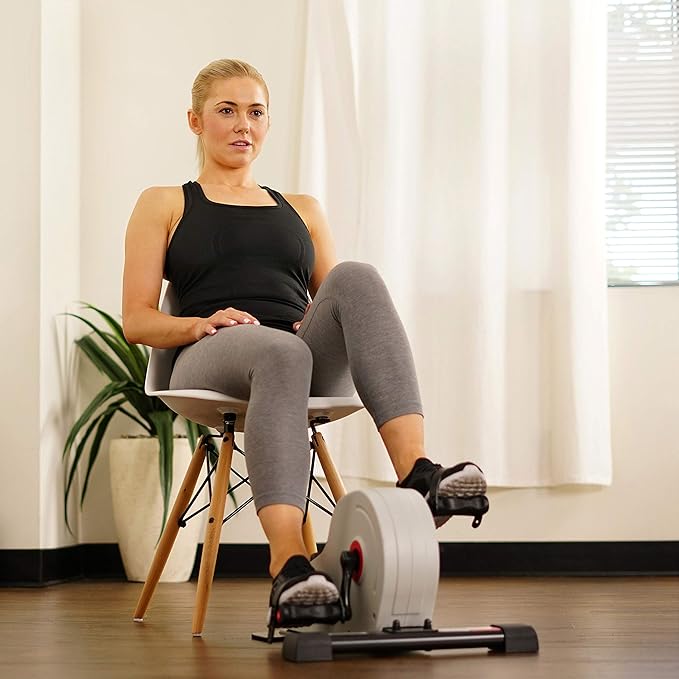 Sunny Health & Fitness Dual Function Under Desk Pedal Exerciser, Portable Indoor Cardio Mini Bike at Home, Arm/Leg Cycle for Seniors, Optional Magnetic, Motorized & Free SunnyFit App Bluetooth Connect-Ruum Studio Home