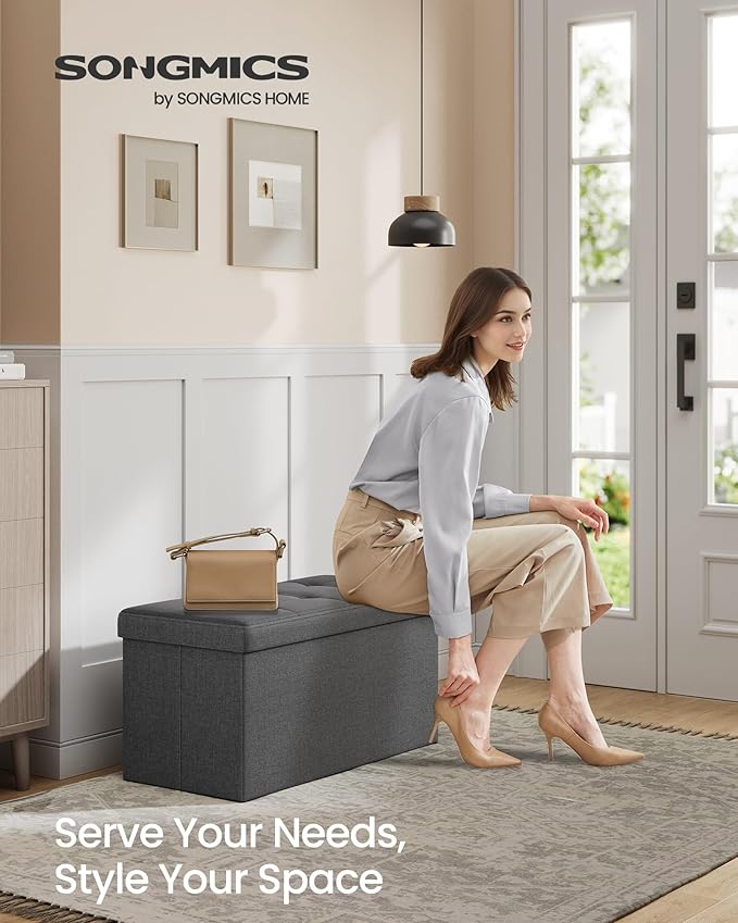 SONGMICS MAZIE Collection - 30 Inches Folding Storage Ottoman Bench, Ottoman Foot Rest, End of Bed Bench, Storage Chest, Load 660 lb, for Living Room, Bedroom, Entryway, Dark Gray ULSF47K-Ruum Studio Home