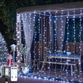 JMEXSUSS 900LED Christmas Curtain Lights, 9.5x29.5ft White Indoor/Outdoor Plug-in with Remote, Window Hanging String Lights for Bedroom, Wedding, Xmas Decoration-Ruum Studio Home