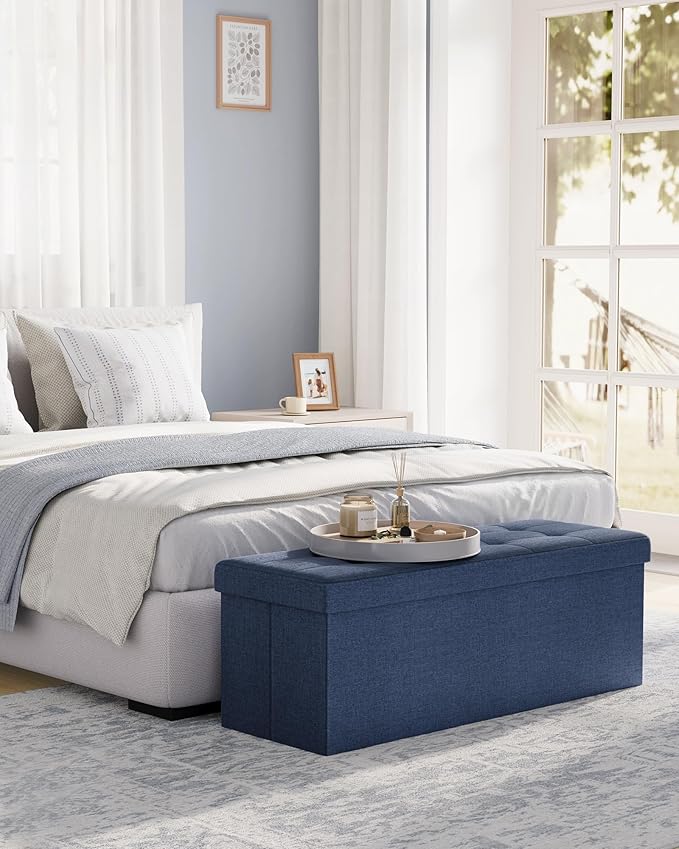 SONGMICS MAZIE Collection - 43 Inches Folding Storage Ottoman Bench, Ottoman Foot Rest, End of Bed Bench, Storage Chest, Load 660 lb, for Living Room, Bedroom, Entryway, Midnight Blue ULSF77IN-Ruum Studio Home