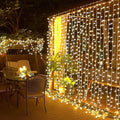 JMEXSUSS 300 LED Remote Control Curtain Lights, Plug in Fairy Curtain Lights Outdoor, Window Wall Hanging String Lights for Bedroom Backdrop Wedding Party Indoor Christmas Patio Dorm Decor, Warm White-Ruum Studio Home