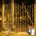JMEXSUSS 900 LED Outdoor Christmas Curtain Lights, 9.5x29.5ft Christmas Lights Plug in with Remote, Twinkle Hanging String Light for Bedroom Wall Wedding Backdrop Window Gazebo Decor, Warm White-Ruum Studio Home
